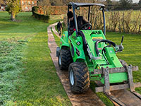 Avant for lifting and planting trees in use by Vincent Fencing
