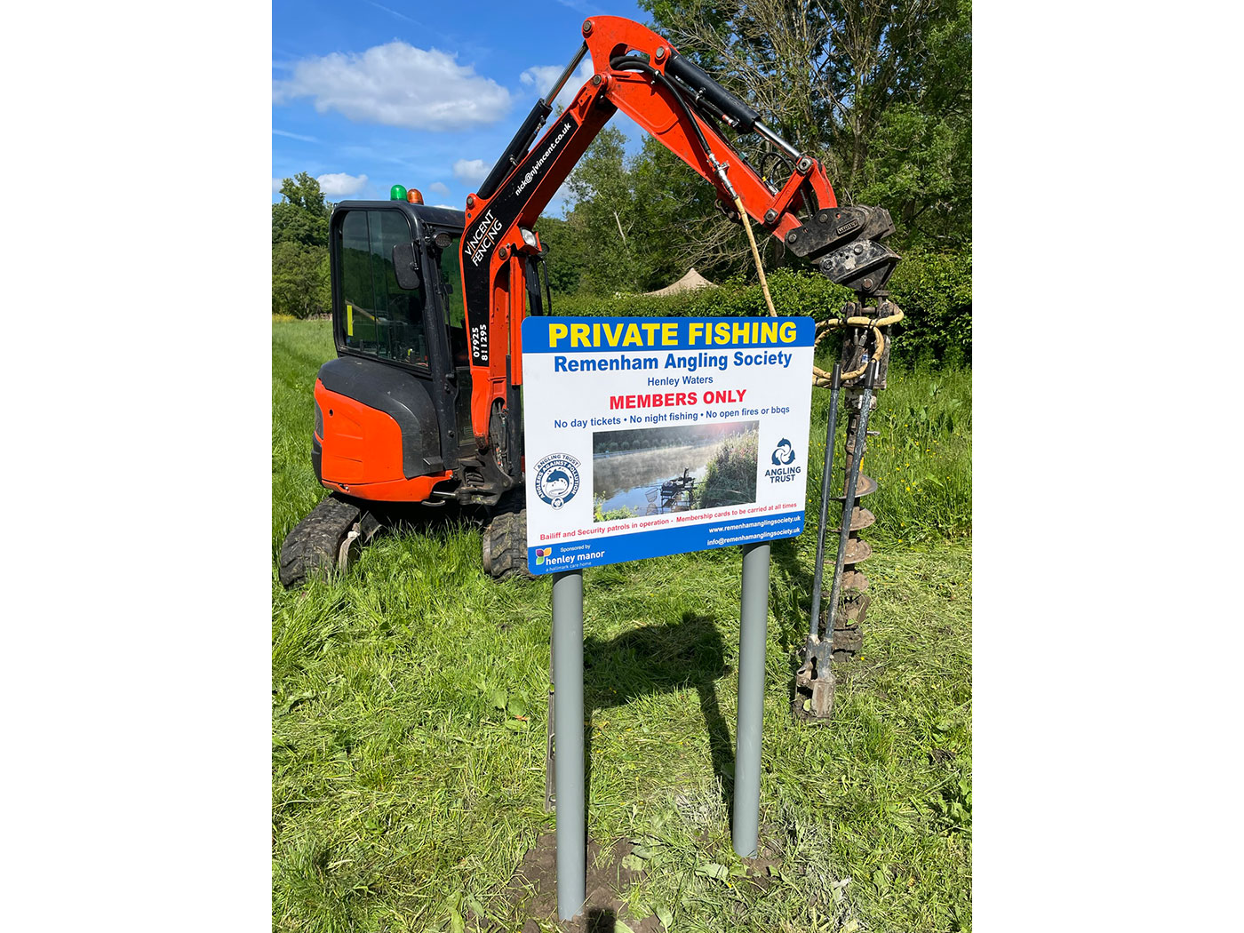 Vincent Fencing installing sign using Kubota