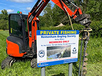 Vincent Fencing installing sign using Kubota