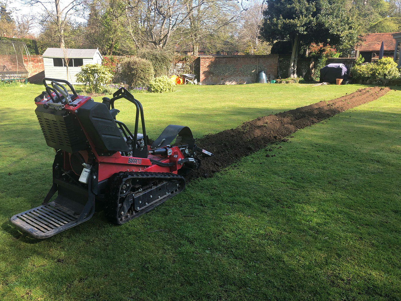 Trench digging for underground utilities by Vincent Fencing