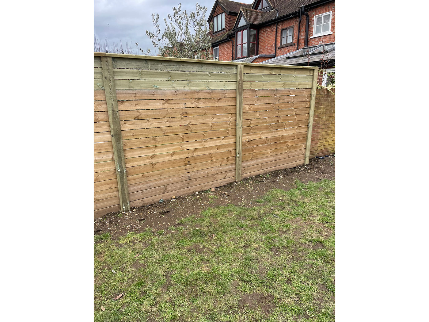 Bespoke slatted fencing by Vincent Fencing
